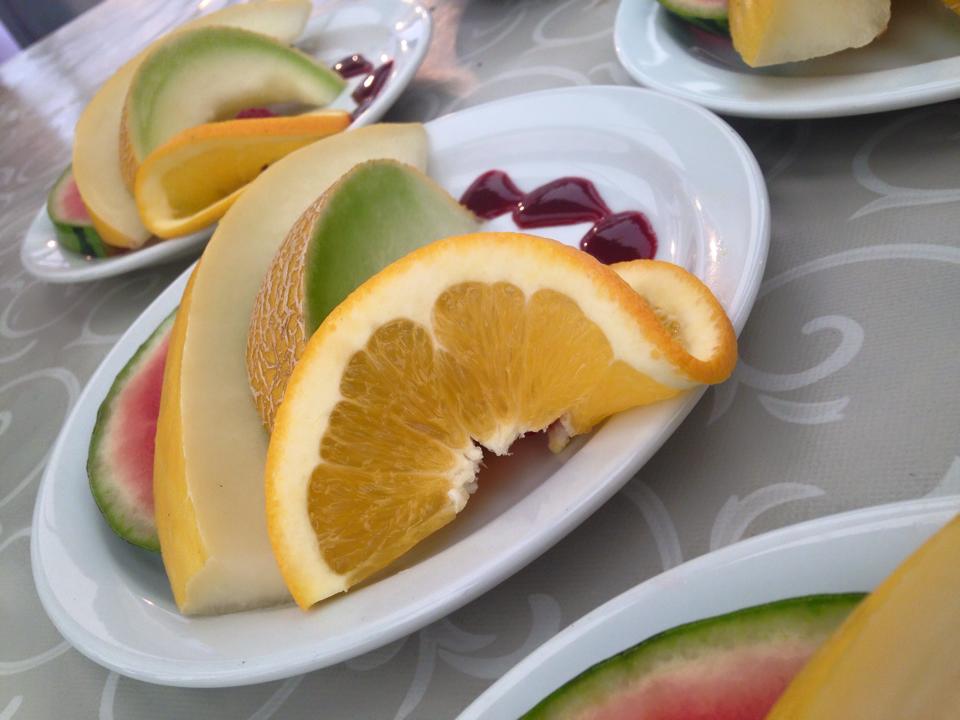 Melon fan served with fresh fruit and Rasberry coulis